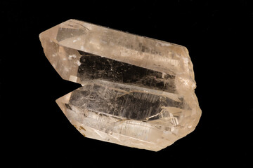 Close-up image of a milky quartz crystal on a black background