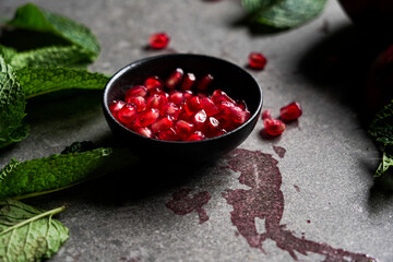 pomegranate seeds in a small bowl