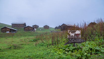 chalets in the mist.Life on the mountain. foggy day view.