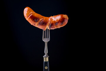 fried sausage on a fork