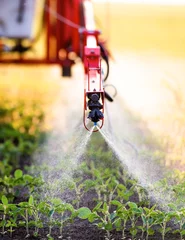Foto op Plexiglas Nozzle of the tractor sprinklers © Dusan Kostic