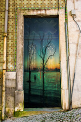 Old wooden door superimposed on a sunset in the lagoon.