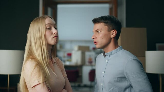 Abusive boyfriend shouting girlfriend at new home close up. Man swearing woman.