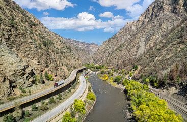 Interstate 70 (I-70) beside the Colorado River in the Rocky Mountains of Colorado in autumn -...