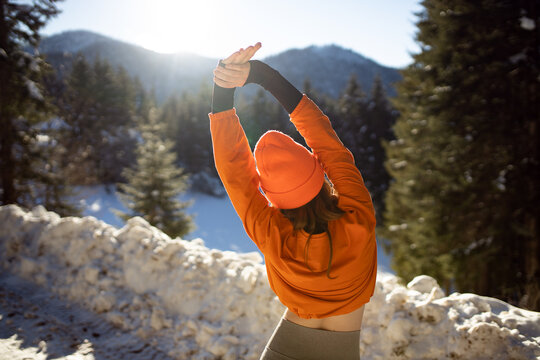 Woman doing exercise at winter