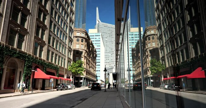 People and traffic move along the downtown city streets of Dallas Texas USA
