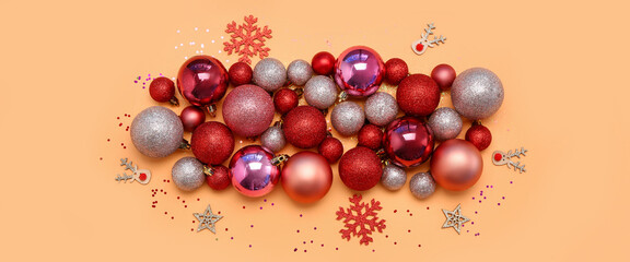 Beautiful composition with Christmas decorations on color background