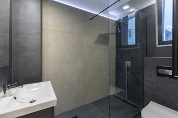 Bathroom interior with glass shower cabin