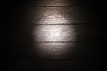 Black wooden texture and backlight as background