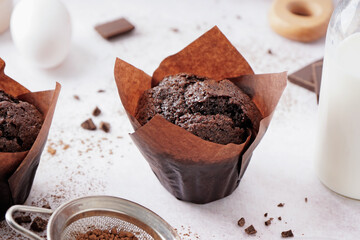 Sweet chocolate muffin on table
