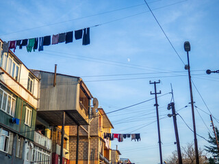 laundry is dried on clothesline. City environment. Asian city streets. Linen is dried in the open air.