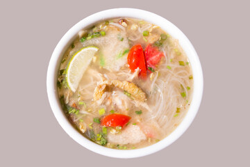 Soto lamongan, East Java, Indonesian soup with main ingredients of chicken, white noodles and fried onions. top view, clipping path