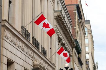 Canadian flags on building in downtown district in Sparks street