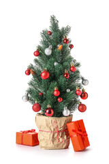 Small Christmas tree with gifts on white background