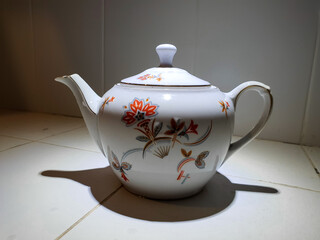 teapot on tile table 