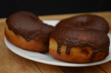 Beautiful handmade donuts covered in chocolate and sugar