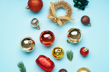 Beautiful Christmas decorations with fir branches on blue background