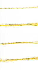 Orange, lemon juice or oil lubricant splash, liquid gold yellow drink drops. Fruit beverage water elements in line form . Fresh splashing and flowing jets, white background isolated freeze motion