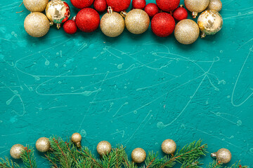 Frame made of Christmas balls and fir branches on grunge background