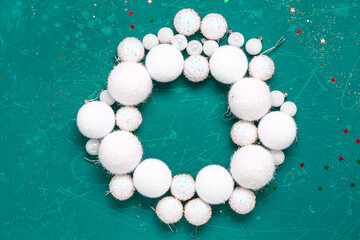 Frame made of white Christmas balls on grunge background