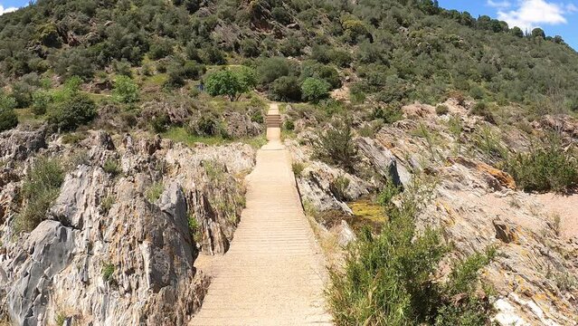 a cement footpath leaving Pulo do Lobo waterfall, Guadiana river, municipality of Mértola, district of Beja, Alentejo, Portugal