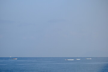 People fishing on a fishing boat on a sunny day in the Seto Inland Sea