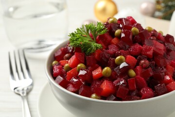Traditional Russian salad vinaigrette in bowl, closeup