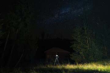 Modern telescope at night outdoors. Learning astronomy