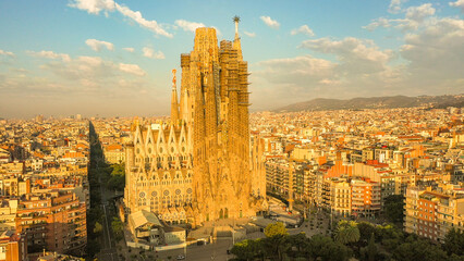 Closeup aerial view of the Sagrada Familia cathedral in Barcelona, Spain. Cathedral is bathed in...