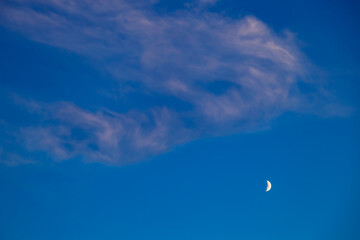 Light haze in the rays of the moon in the blue sky natural phenomenon