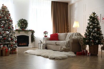 Obraz premium Festive living room interior with Christmas trees and fireplace