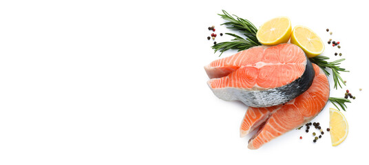Fresh raw salmon steaks with rosemary, peppercorns and lemon on white background, top view. Banner...