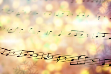 Sheet with music notes as background, closeup. Christmas songs