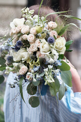 A bouquet of delicate flowers as an option for a wedding