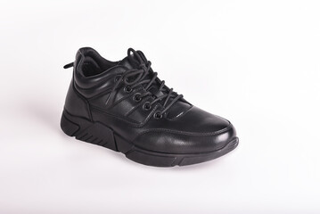 Black winter boot with black laces on a white background