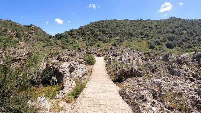 a cement footpath that takes us to Pulo do Lobo waterfall, Guadiana river, municipality of Mértola / Santa Maria, district of Beja, Alentejo, Portugal