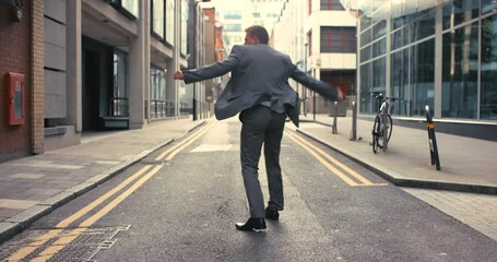 City, celebration and businessman dancing street in suit, excited energy and happy with achievement. Music, dance and corporate business man in road, urban success and celebrate startup deal or goal. - Powered by Adobe