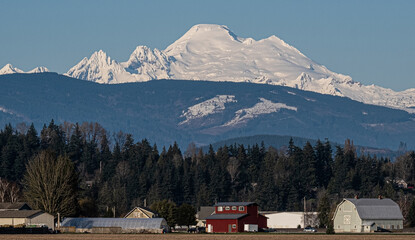 Snowy mountain towers over valley