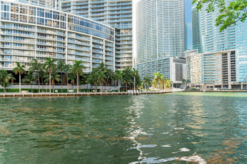 Fototapeta na wymiar Luxury condominium buildings with balconies and glass exterior at the bay in Miami, Florida