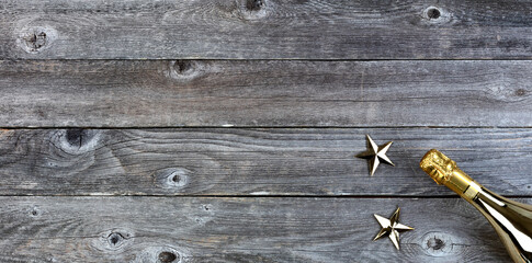 New Year celebration background with golden champagne bottle and stars. Perfect for other events like Christmas, birthday or anniversary © tab62