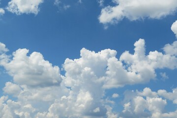 Beautiful fluffy clouds in blue sky, natural background