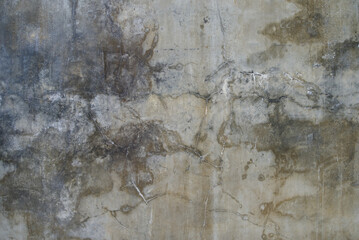 The cement flap surface has scratches, black and white stains, traces caused by plastering to create an artistic pattern