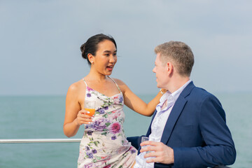 luxury relaxing couple traveler of cruise yacht with background of sea and white sky. Concept business travel. Cruise luxury travel lifestyle businessman and woman on vacation.