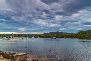 Sunrise with rain clouds over the bay