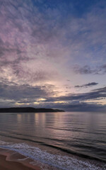 Fototapeta na wymiar Aerial sunrise seascape with rain clouds