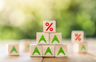 Interest rate financial and mortgage rates concept. Wooden cube block with interest rate and up arrow. Mortgage rates business concept of investment real estate interest rates appraisal.