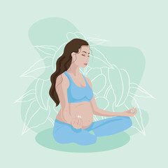 yoga pregnant girl on the green background with plants