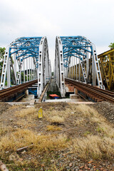 Karawang, Indonesia, 25 November 2022: The blue sky railway bridge is centered in Karawang