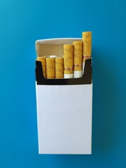 cigarettes and cigarette packs with empty space on white, realistic photo illustration