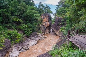 Beautiful view from small iron bridge over Op Luang Canyon and fast-flowing river in Op Luang National Park, Chiang Mai, Thailand.